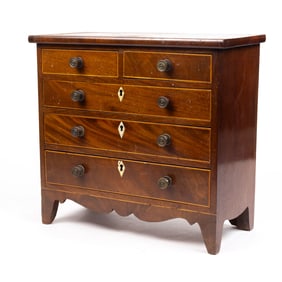 A George III style inlaid mahogany miniature chest of drawers