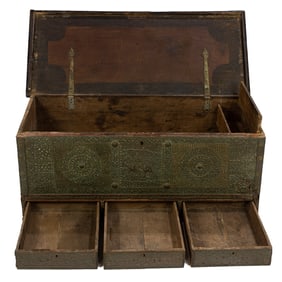 An Anglo Indian style blanket chest allover decorated with brass cut out strapwork and applied