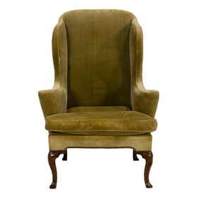 A Queen Anne mahogany wing chair