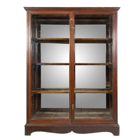 A Renaissance Revival walnut retail display cabinet