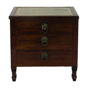 An English mahogany bedside step, circa 1850, the embossed green top opening to a felt interior with