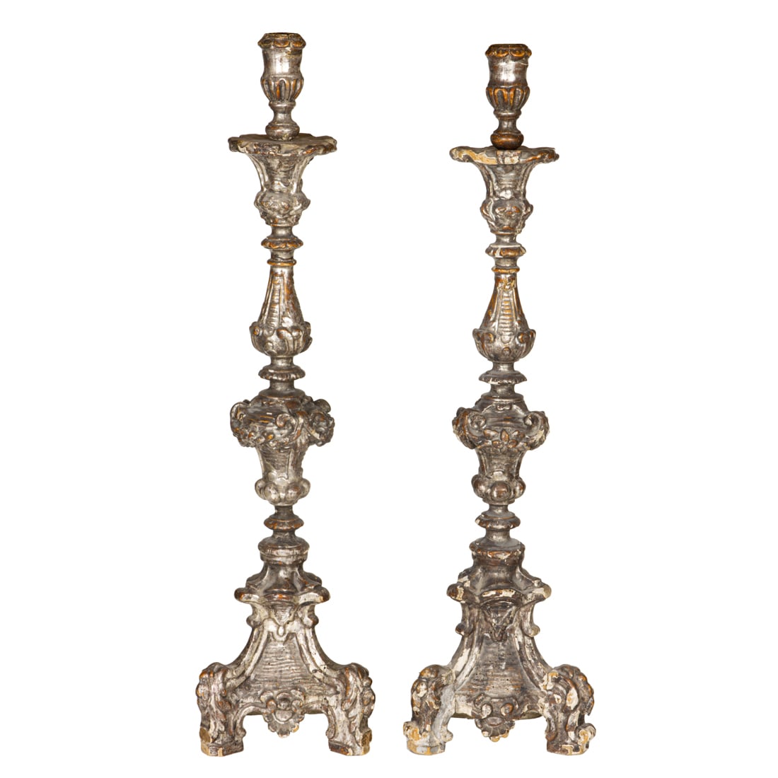 A pair of Continental Baroque silvered gilt candlesticks, 18th century (1 of 2)
