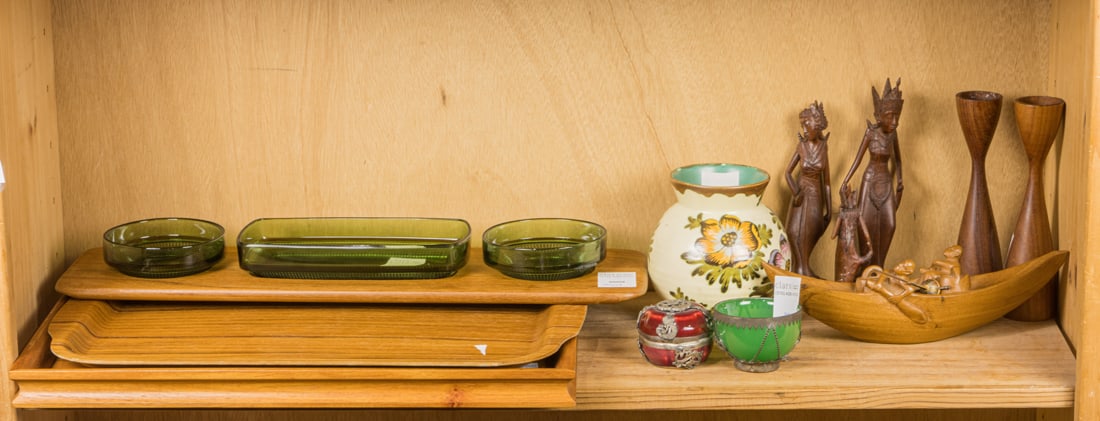 An assembled group of mainly Modern teak table accessories: An assembled group of mainly Modern teak table accessories, comprising pair of candlesticks, 7.5"h; Digsmed hors d'oeuvre stray with green glass dishes, 20"l; (3) Woodflex Phils inlaid wood tray, 17.5