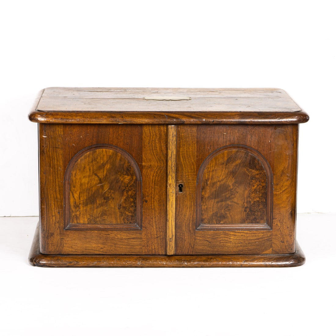 An English walnut flatware canteen, the two-door front opening to an arrangement of four drawers, (1 of 1)
