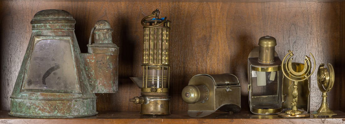 An assembled group of mainly brass nautical accessories, including pair of brass ship lamps with (1 of 1)