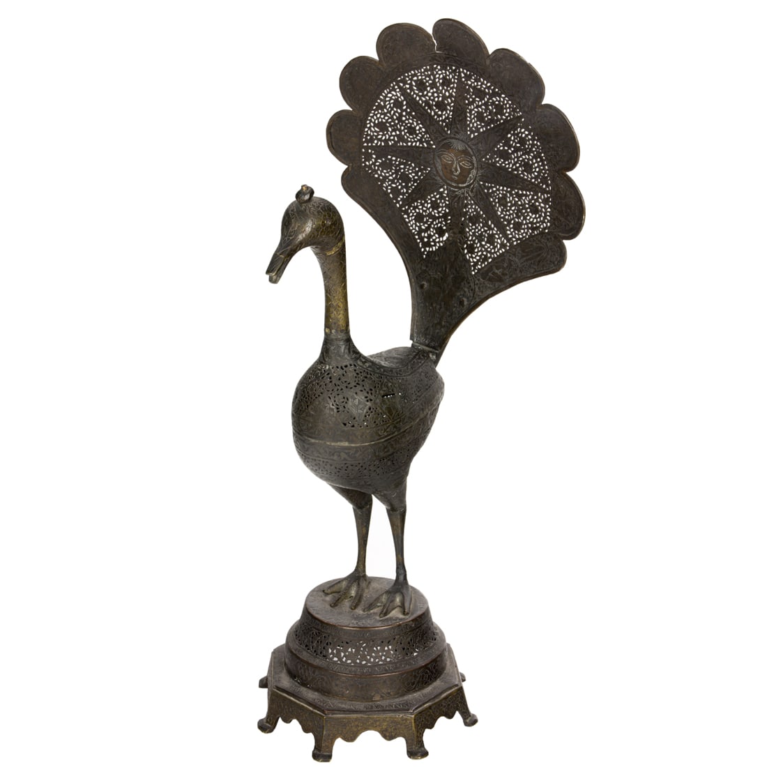 A Persian reticulated metal figure of a peacock: A Persian reticulated metal figure of a peacock 21"h
