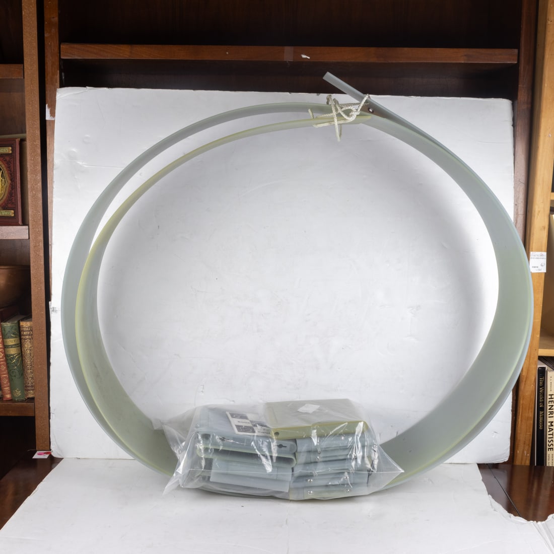 A Kartell Bookworm flexible plastic bookcase designed by Ron Arad in 1994: A Kartell Bookworm flexible plastic bookcase designed by Ron Arad in 1994, each shelf 7.5"h x 6"w