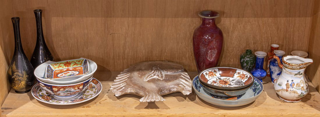 Shelf of Asian decorative objects: Shelf of Asian decorative objects. 20th century, 20" widest.