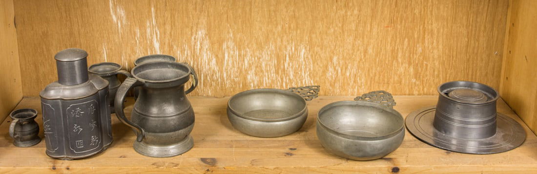 A shelf of Asian decorative metal objects (1 of 1)