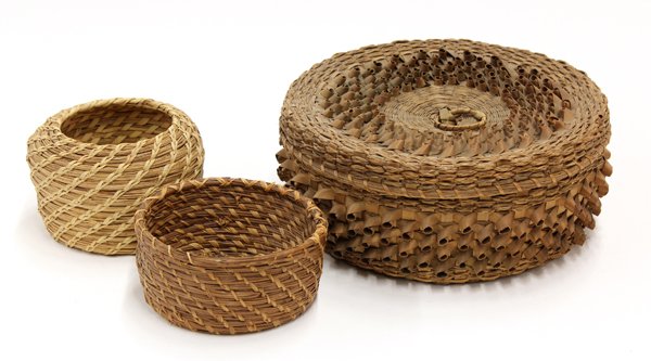 Native American basketry group: (lot of 3) Native American basketry group, consisting of two pine needle baskets (largest 3.5''h) and one Great Lakes curley lidded basket, 4''h x 9''w