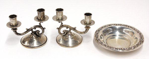 American sterling table accessories: (lot of 3) American sterling silver table accessories consisting of a pair of Fisher weighted two-light candelabra having attached bobeches mounted to an acanthus scroll resting on a socle base, 4.75'