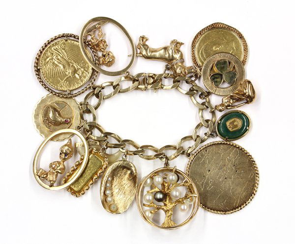 14K gold charm bracelet with (14) charms: Lady's flattened oval link charm bracelet with (14) attached charms; mounted in 14K yellow gold and featuring a 14K yellow gold dachshund charm with diamond collar composed of (5) single cut round dia