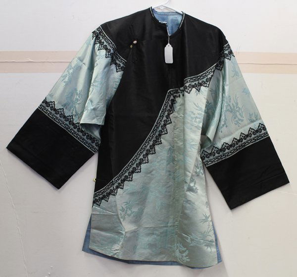 Chinese Silk Robe and Skirt: (Lot of 2) Chinese pale blue robe and skirt, the Han woman's robe with a damask bamboo and prunus pattern in contrast with the black neckline and sleeve band further accented with lace work; together