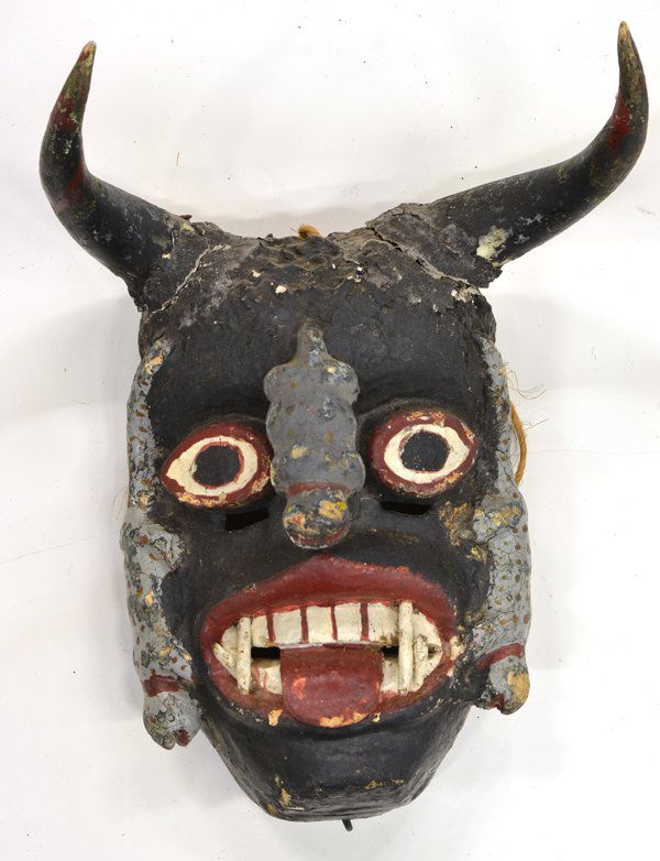 Mexican Dance Mask: Mexico, first half of the 20th century, ceremonial dance mask having horns, animals crawling down nose and cheeks, black with red and white decoration, 11.5''h x 7.5''w. Provenance: from the collectio