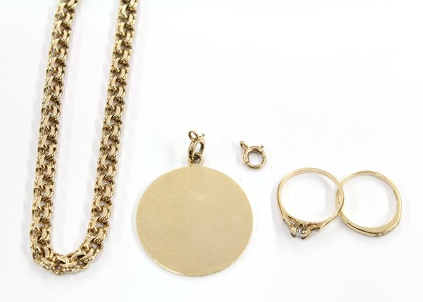 Group of 14K gold and diamond Cartier jewelry: Group of miscellaneous jewelry items, including one 14K yellow gold wedding ring featuring (1) 0.20 ct. Round Brilliant cut diamond with (2) side baguette diamond accents. Ring size 4.5; accompanied b