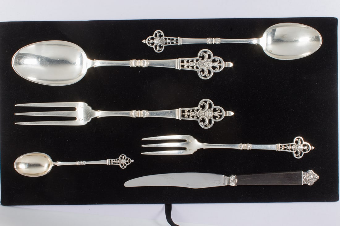 A French Cardheilac Renaissance .950 silver flatware set and two trays: A French Cardheilac Renaissance .950 silver flatware set and two trays, the flatware comprising (12) dinner forks 9"l; (15) luncheon forks 7.25"l; (24) ebonized wood handled knives 8"l (12 with silver