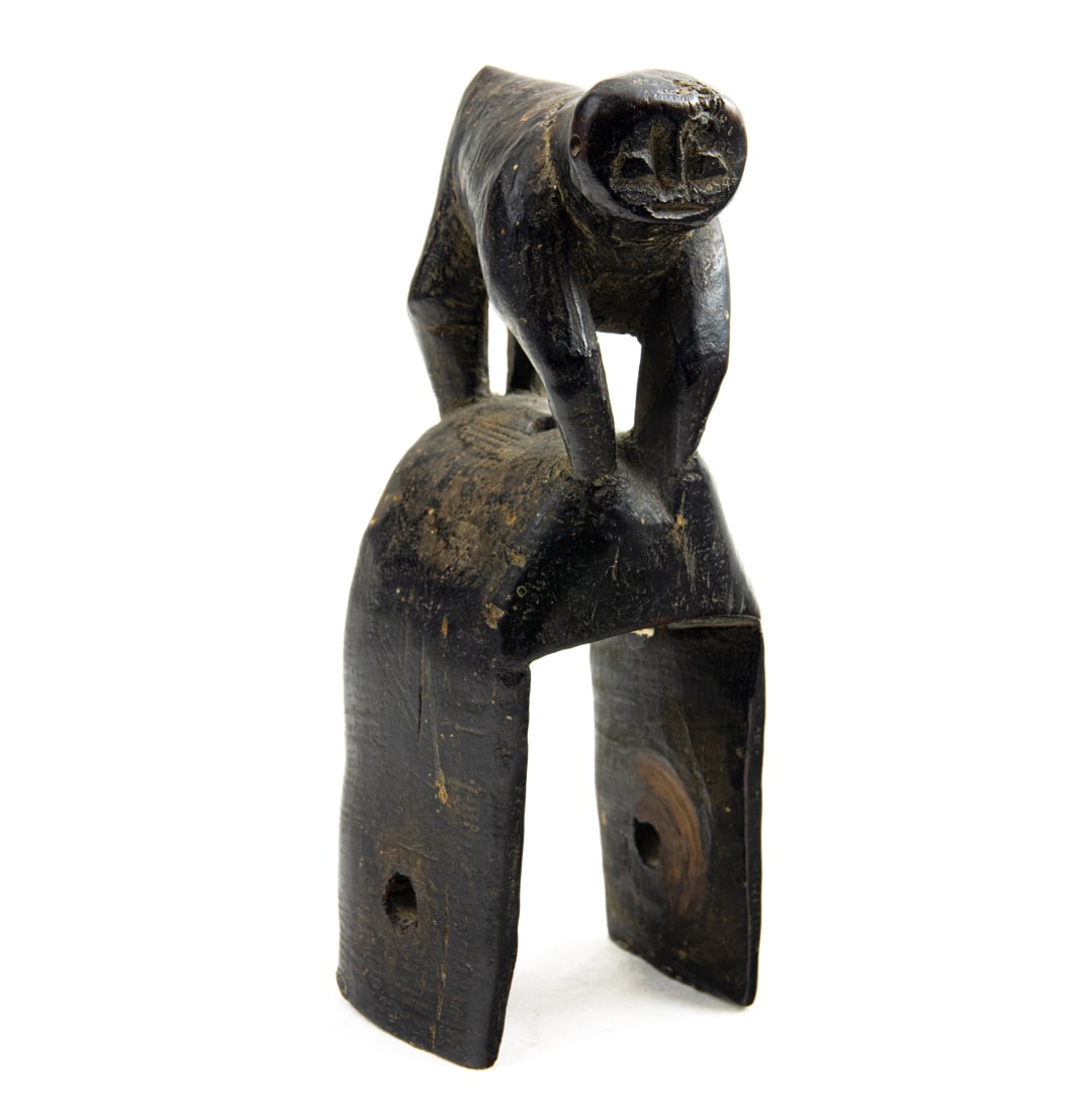 A Senufo Heddle animal form ebonized wood pulley carved as a monkey or a gorilla: A Senufo Heddle animal form ebonized wood pulley carved as a monkey or a gorilla, 5.25"h. Provenance: A San Francisco Estate