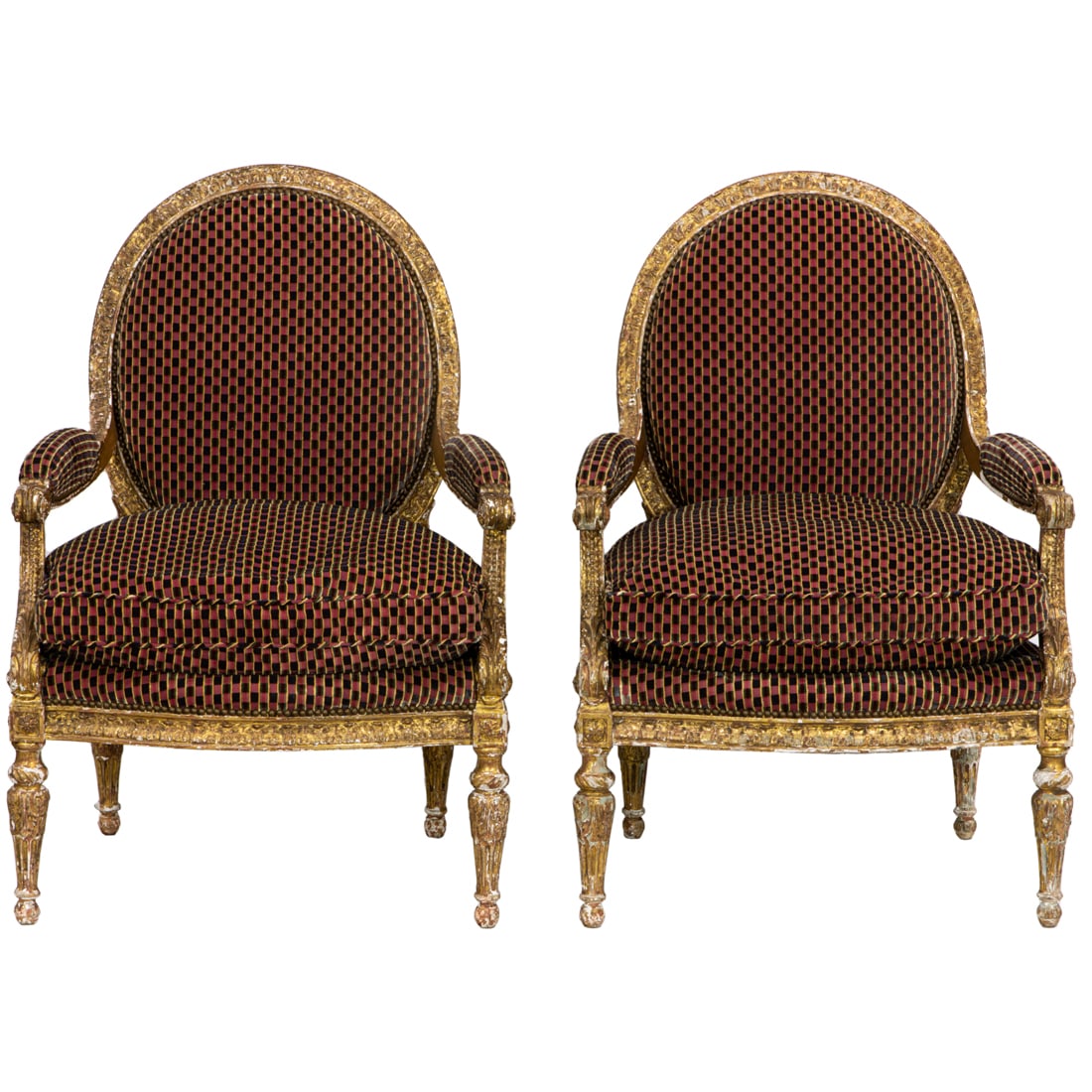 A Pair Italian giltwood carved fauteuils first half 19th century: A Pair Italian giltwood carved fauteuils first half 19th century, each with a carved and gold leaf frame, padded seat and back, and rising on turned and carved legs, 43"h x 30"w x 23"d