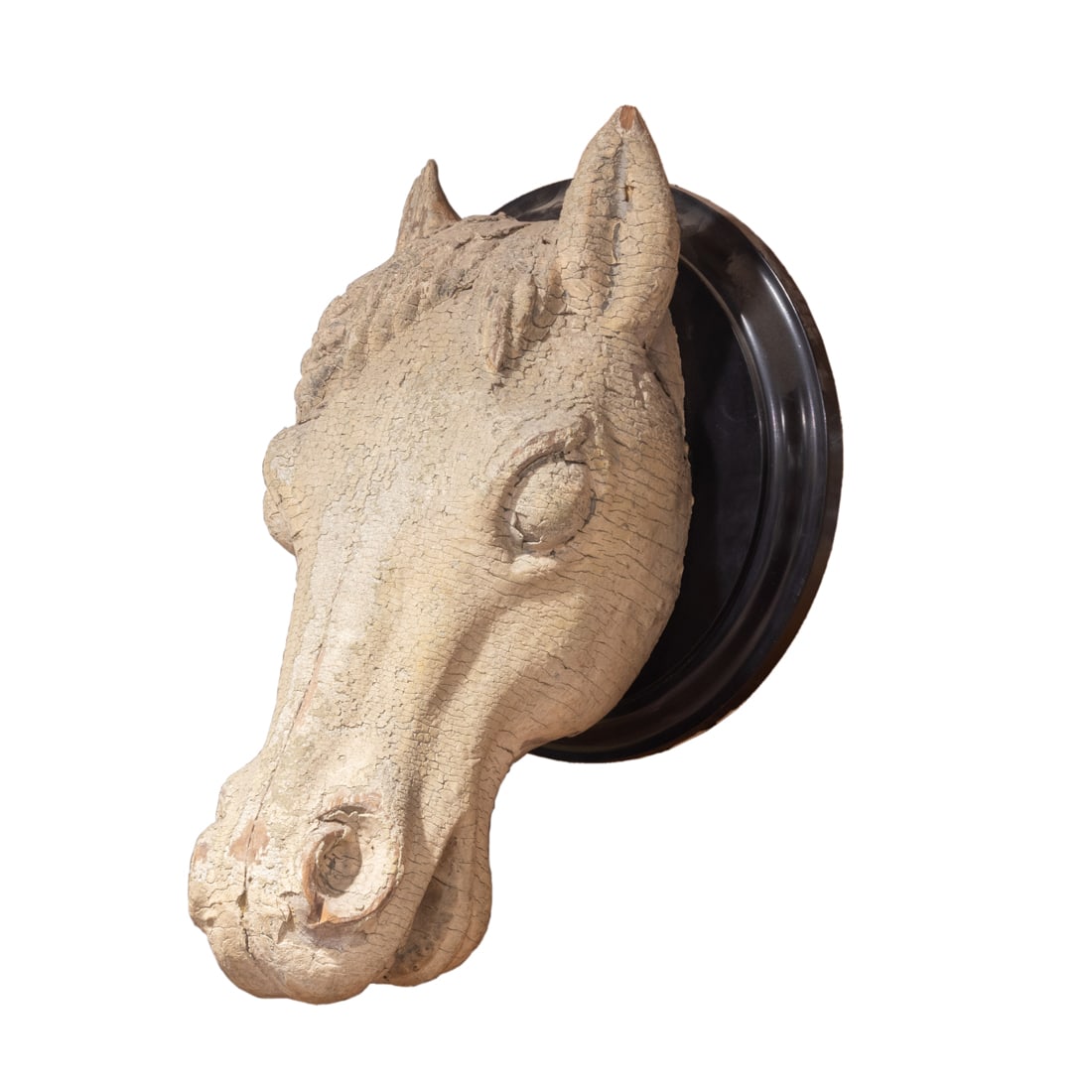A carved and painted horsehead: A carved and painted horsehead, mounted on contemporary ebonized plaque, overall 19"h x 13"d x 13"w. Provenance: Property from the estate of Patricia Moffat Pope, San Francisco, CA. Patricia married G