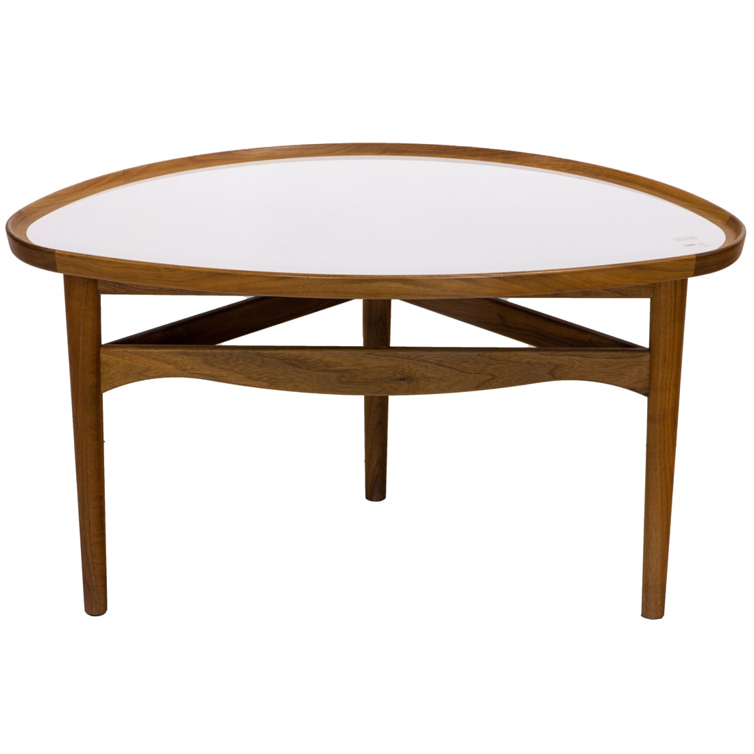 A Finn Juhl Eye coffee table: A Finn Juhl 'Eye' coffee table, executed in teak, the molded oval top with an inset white laminate top rising on tapered legs, joined by carved horizontal support bars, 'One Collection/House of Finn J