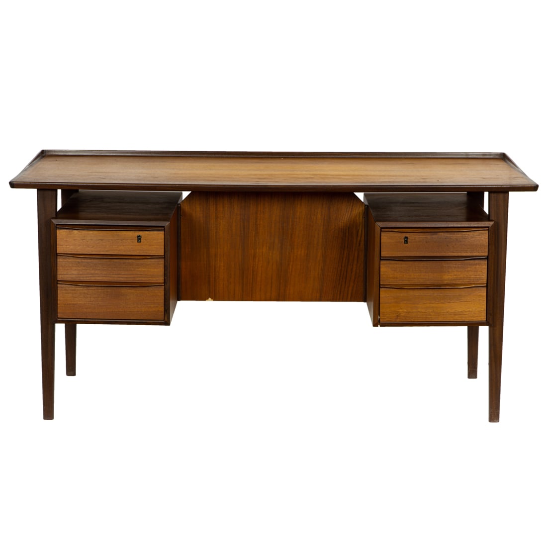 An Arne Vodder teak executive desk: An Arne Vodder teak executive desk, 1950's, 29" h x 61"w x 27.5" d