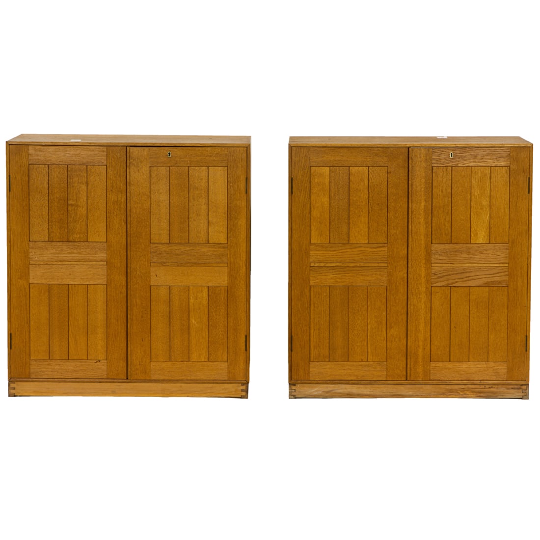 Two Danish Mogens Koch for Rud Rassmussen elm cabinets: Two Danish Mogens Koch for Rud Rassmussen elm cabinets, the case with dove tail construction, twin paneled doors, one labelled cabinet opening to reveal five pullout drawers, the other reworked with t