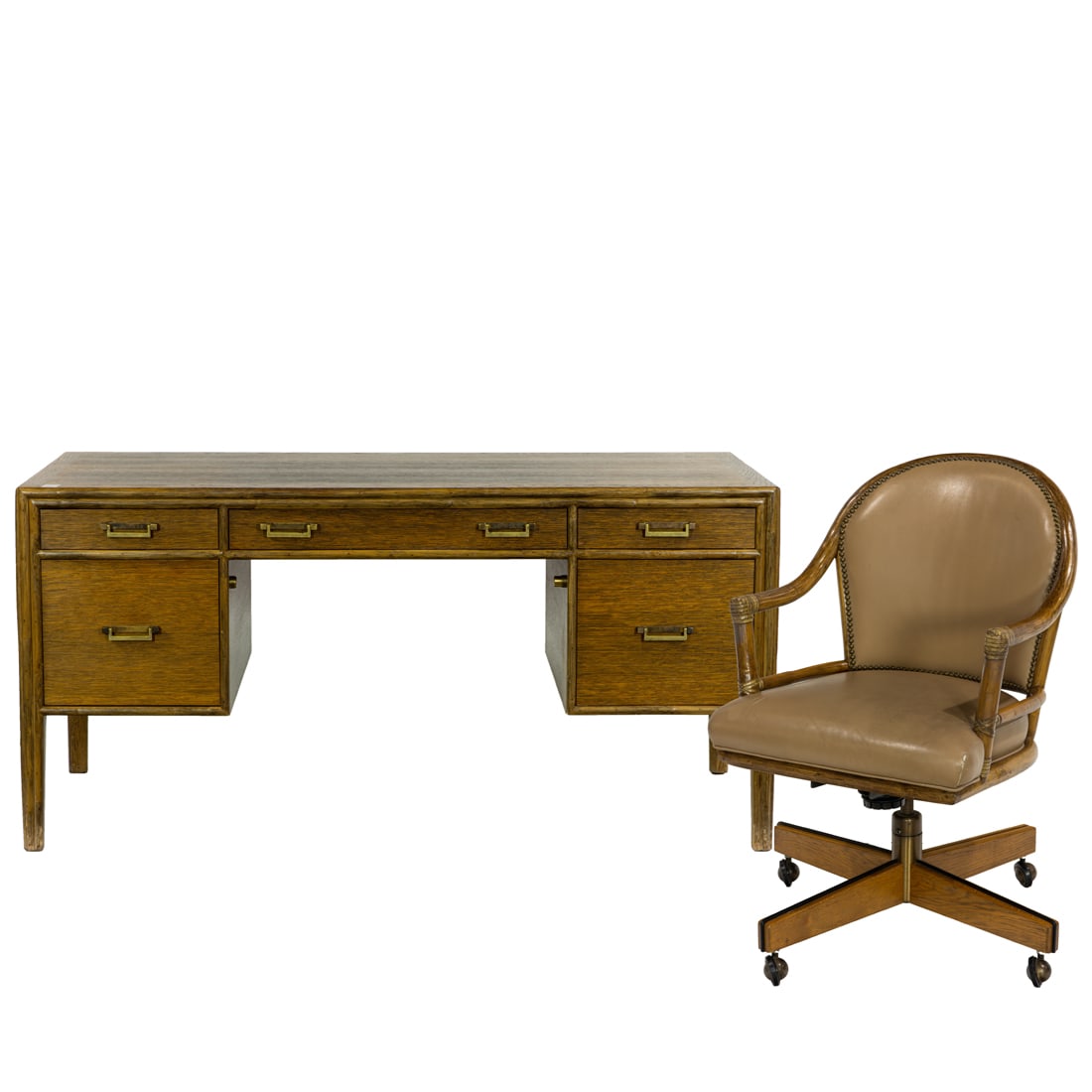 A Contemporary McGuire oak desk and swivel desk chair: A Contemporary McGuire oak desk, the kneehole form with a long drawer flanked by two short drawers, over two file cabinet drawers, each fitted with brass drop handles, 29.5"h x 60"w x 30"d, with swive