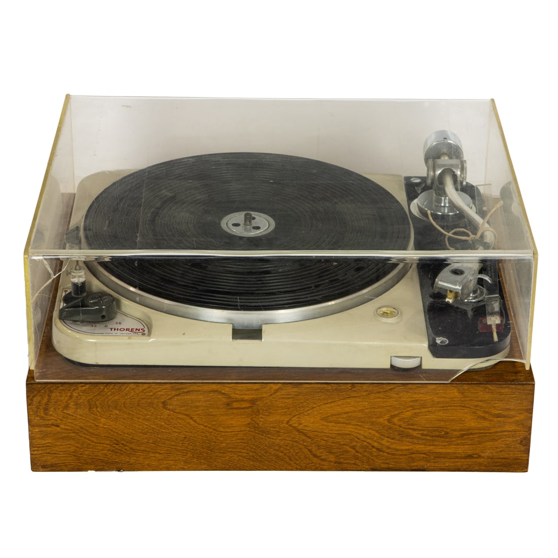 A Thorens turntable, Switzerland, with Ortofon ESL tonearm, numbered 98070 to underside of movement: A Thorens turntable, Switzerland, with Ortofon ESL tonearm, numbered 98070 to underside of movement and raised on a teak plinth.
