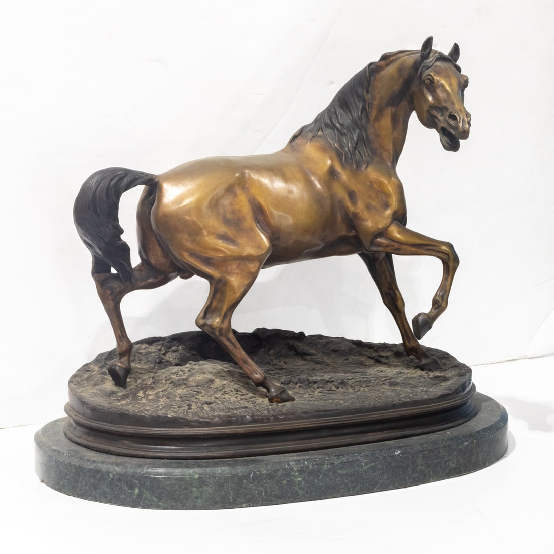 A patinated bronze equestrian figure after Pierre Jules Mene (1 of 2)
