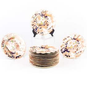 A set of twelve Royal Crown Derby porcelain luncheon plates