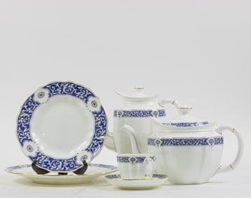 A Royal Crown Derby porcelain partial dinner service in the Milldale pattern