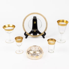 A suite of optic glass stemware with tooled gilt rims