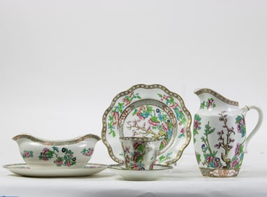 A Coalport porcelain partial dinner service in the Indian Tree pattern