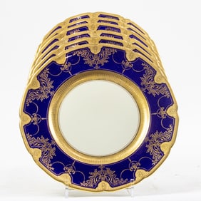 A set of twelve Lenox gilt decorated cobalt border service plates