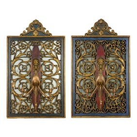 A pair of Continental painted fretwork mirrored three-light girandoles