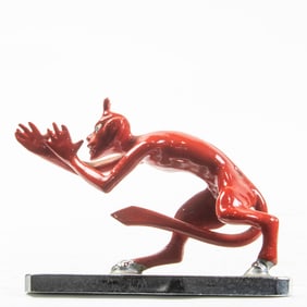 A Louis LeJeune Ltd. enameled metal and chrome car mascot of a devil thumbing nose
