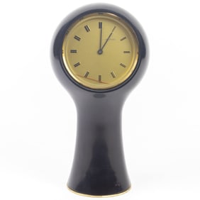 A Secticon black plastic and lacquered brass clock, model T1