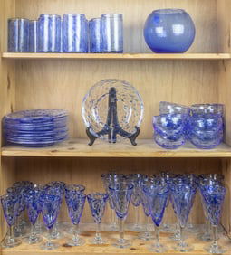 A mottled blue and clear blown glass suite of stemware