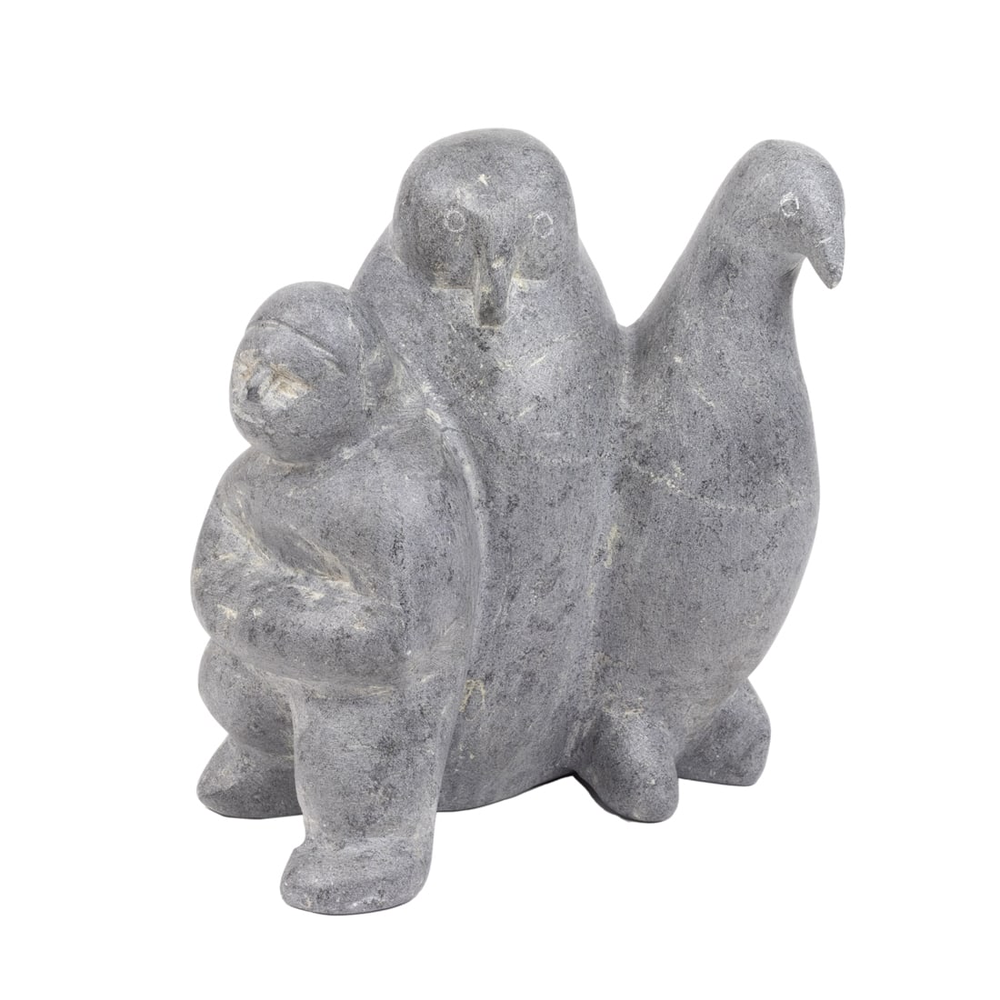 A large Tona Iquilik soapstone group of man and two standing birds (1 of 3)