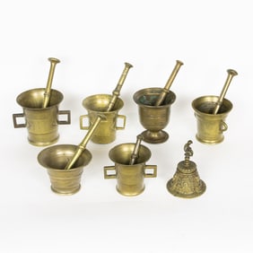 Six brass mortars and pestles in various sizes