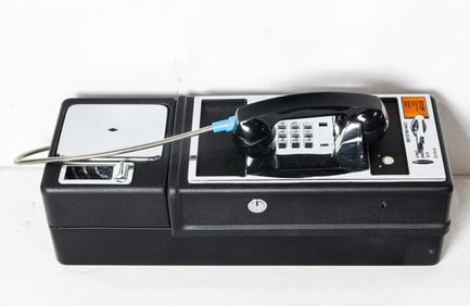 Five wall mount pay phones in original boxes, takes US coins