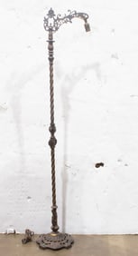 An Arts and Crafts wrought iron floor lamp