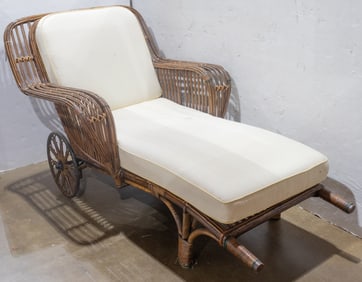 A Bar Harbor style rattan chaise longue in shape of rickshaw