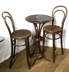 A pair Thonet labeled bentwood chairs with shell embossed seats 35