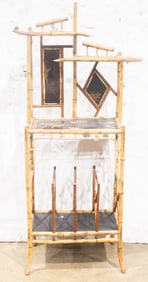 An Aesthetic Movement bamboo and lacquered what not stand