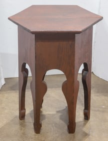 An Aesthetic Movement oak table with octagonal top