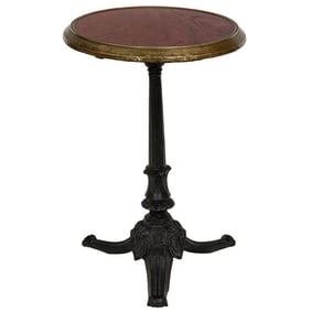 A brass mounted bistro table