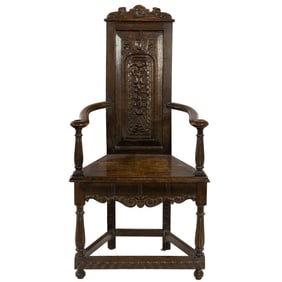 An English Baroque style oak hall chair