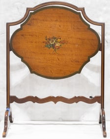 An Edwardian saltinwood tilt top table with painted floral spray