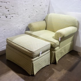 A traditional lounge chair and ottoman